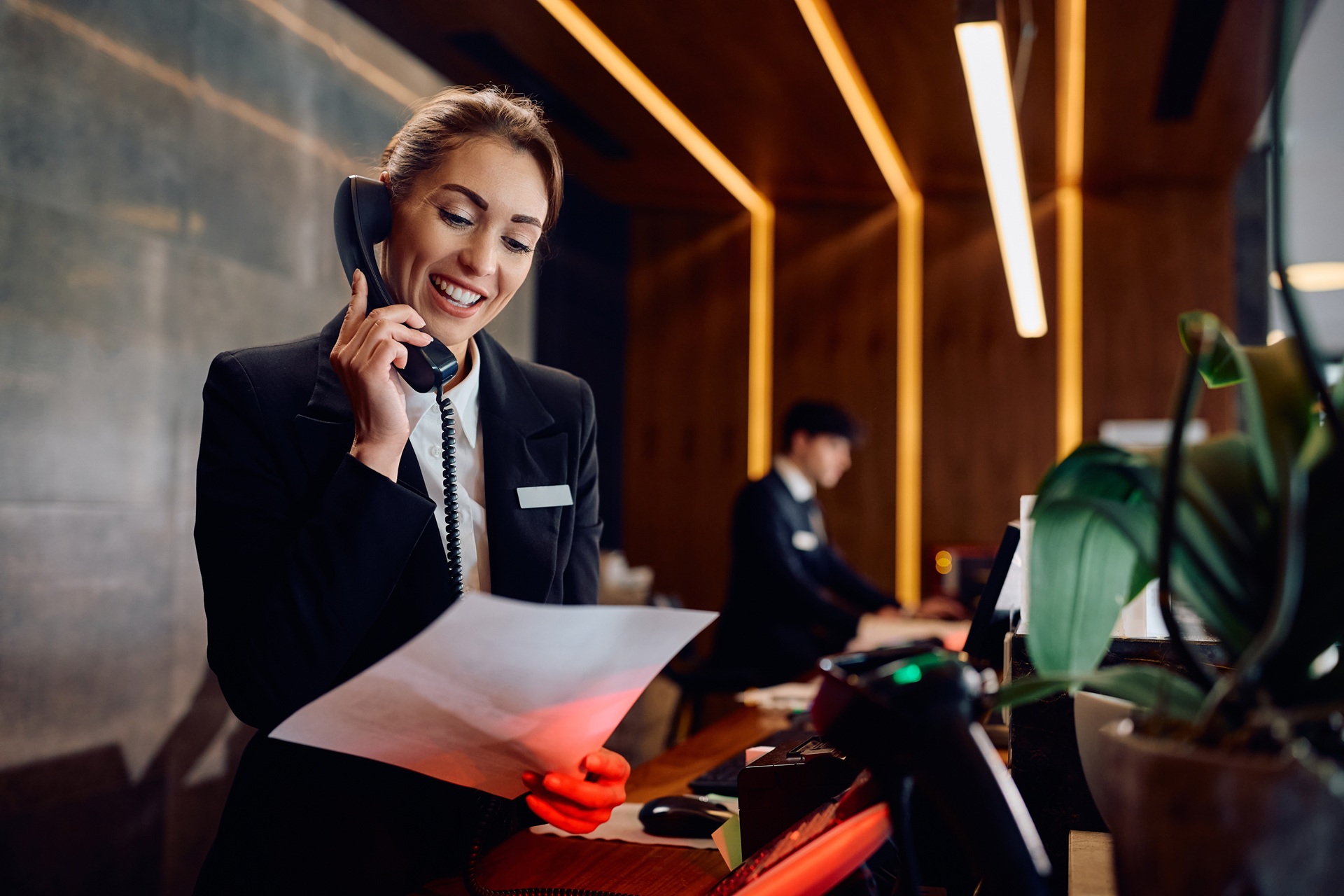 Hotel clerk takes reservation and card-not-present payment over the phone.